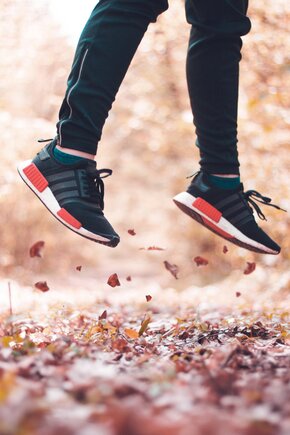 tennis shoes in the air