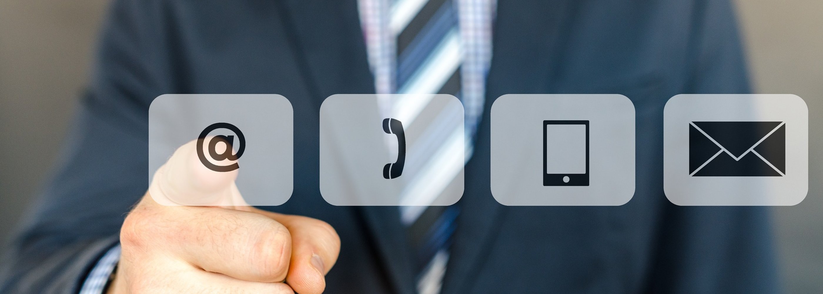 Man pointing at icons for email, phone, mail