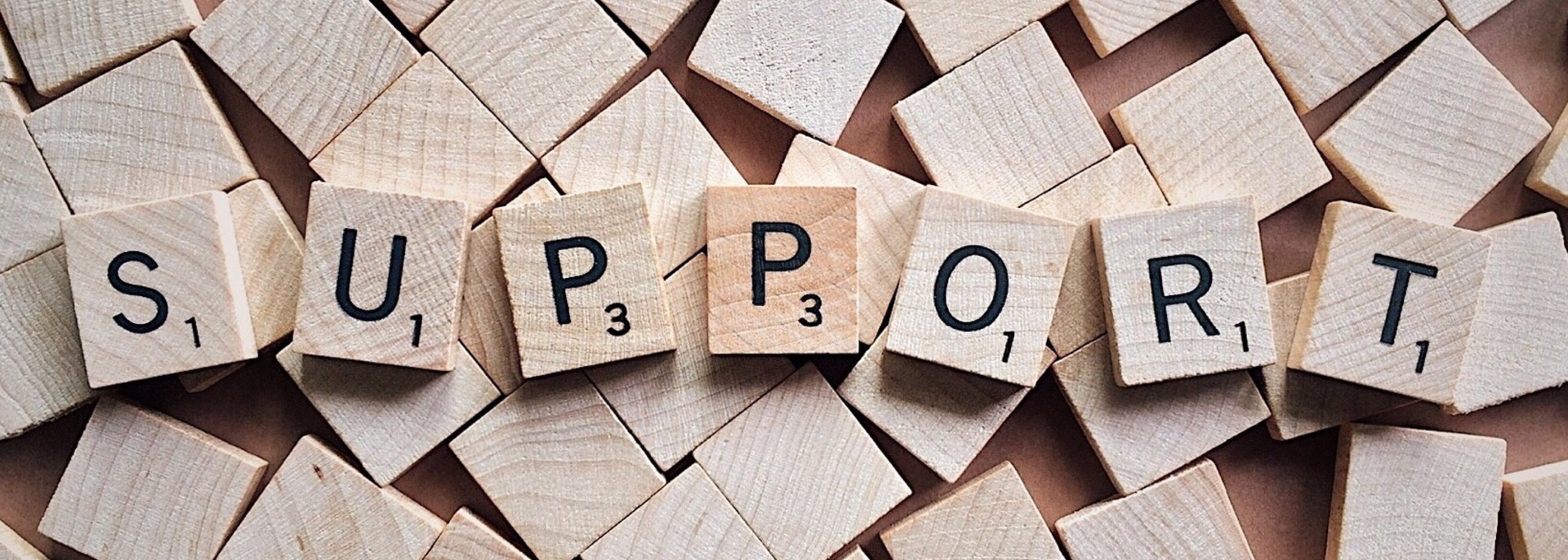 SUPPORT spelled with block tiles
