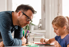 parent with girl studying